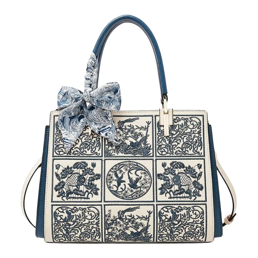 sylvia™ – unique crossbody with embroidery and bow detail