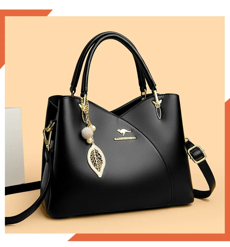 felina™ – black shoulder bag with elegant pendants