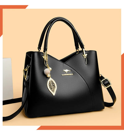 felina™ – black shoulder bag with elegant pendants