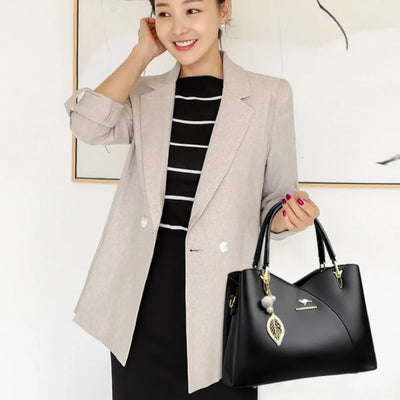 felina™ – black shoulder bag with elegant pendants