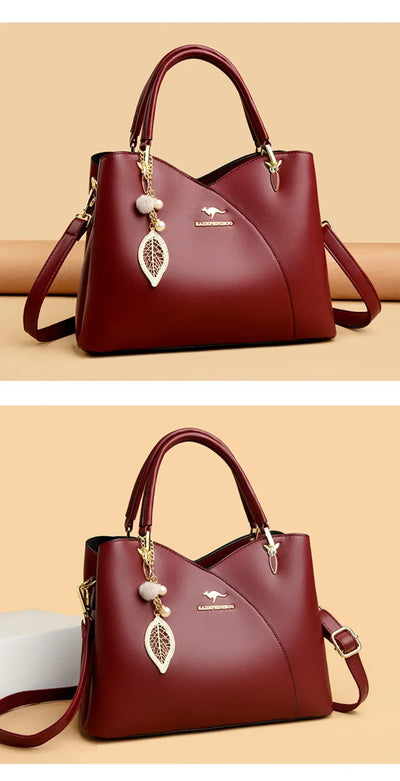 felina™ – black shoulder bag with elegant pendants