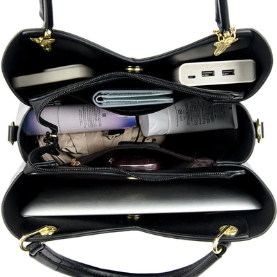 felina™ – black shoulder bag with elegant pendants