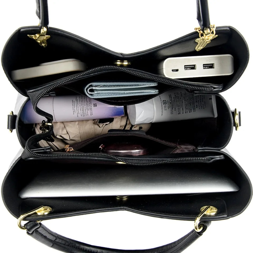 felina™ – black shoulder bag with elegant pendants
