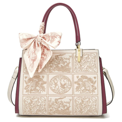 sylvia™ – unique crossbody with embroidery and bow detail