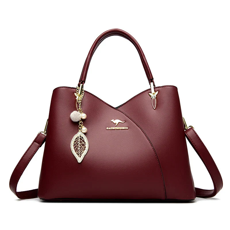 felina™ – black shoulder bag with elegant pendants