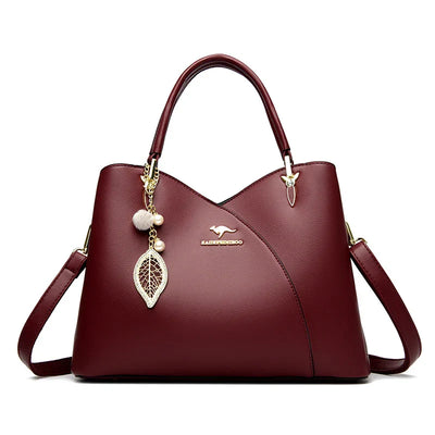 felina™ – black shoulder bag with elegant pendants