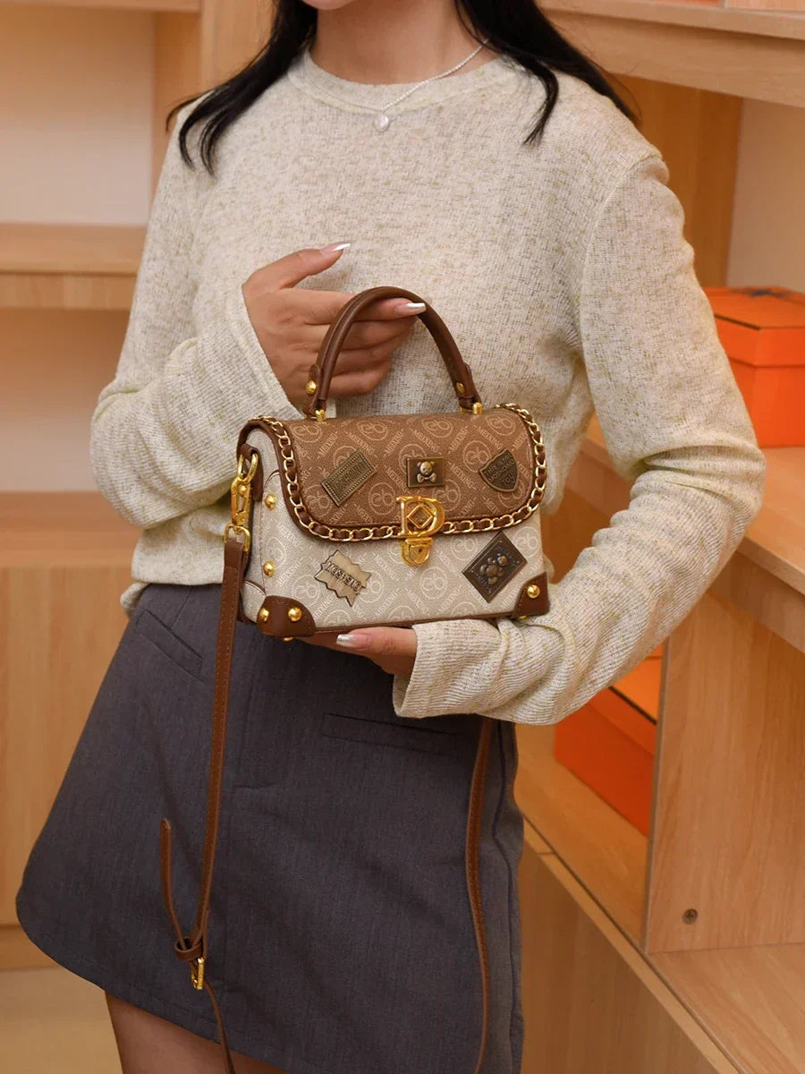 zelda™ – retro shoulder bag with monogram and gold details