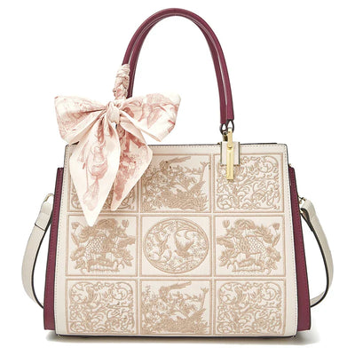 sylvia™ – unique crossbody with embroidery and bow detail